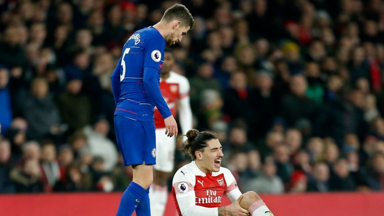 Hector Bellerin reacts after picking up an injury in the game against Chelsea