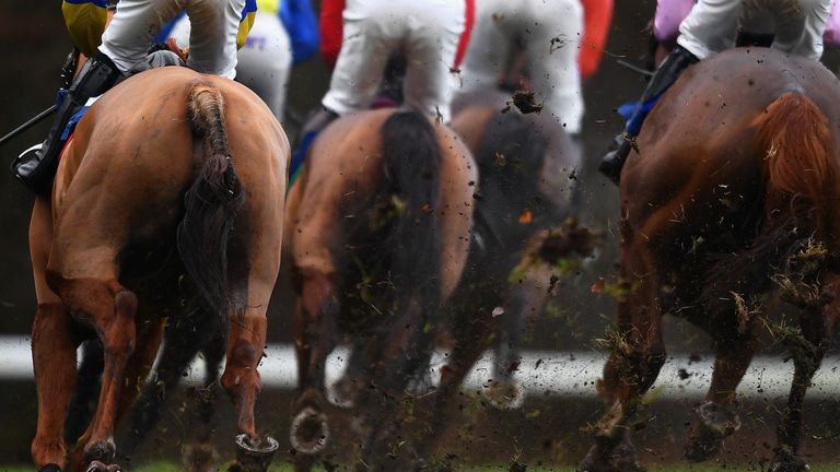 EXETER, ENGLAND - DECEMBER 20: A large amount of ground flies up as runners make their way around the course on their way to winning the starsports.bet Handicap Hurdle at Exeter Racecourse on December 20, 2018 in Exeter, England.  (Photo by Harry Trump/Getty Images)