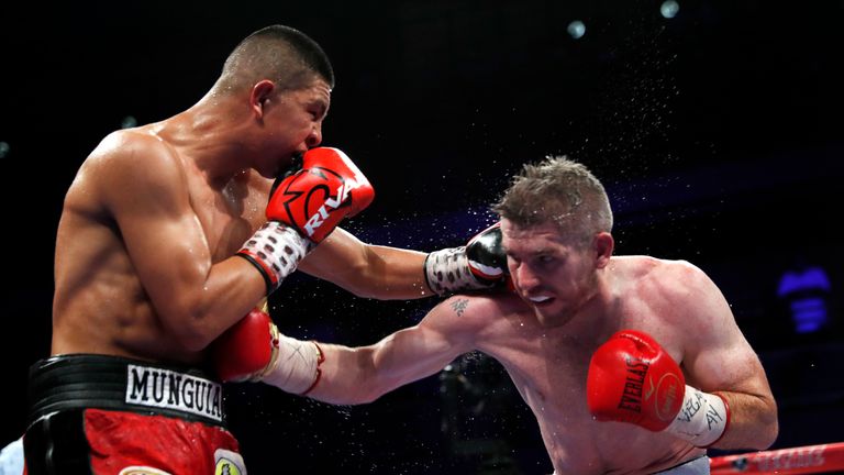  WBO junior middleweight champion Jaime Munguia (L) of Mexico trades punches with Liam Smith of England during their title fight on July 21, 2018 in Las Vegas, Nevada. Munguia retained his title by unanimous decision.(Photo by Steve Marcus/Getty Images)