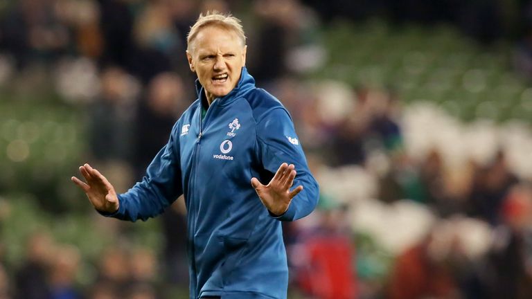 Ireland's coach Joe Schmidt checks out pitch conditions ahead of the rugby union test match between Ireland and New Zealand at the Aviva stadium in Dublin on November 17, 2018. 