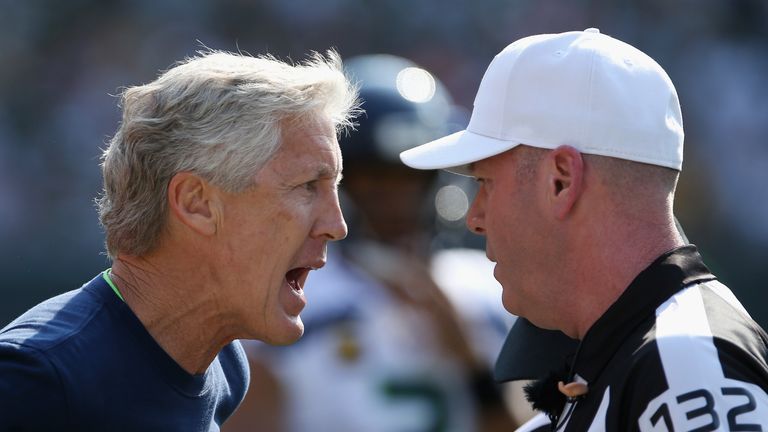 Head coach Pete Carroll of the Seattle Seahawks argues a call with referee John Parry #132 during the first half of the game between the Seattle Seahawks and the Green Bay Packers at Lambeau Field on September 10, 2017 in Green Bay, Wisconsin. 