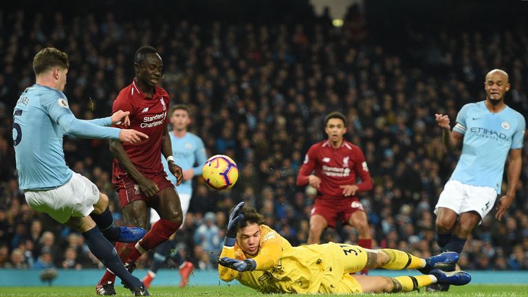 John Stones strikes Ederson while attempting to clear the ball