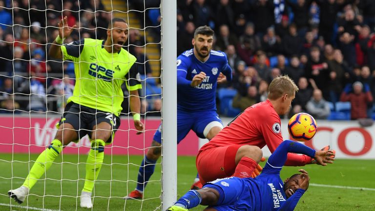 Jonas Lossl makes a save from Junior Hoilett