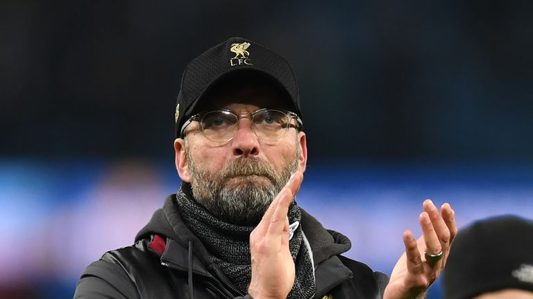 Jurgen Klopp applauds Liverpool fans after the 2-1 loss to Manchester City
