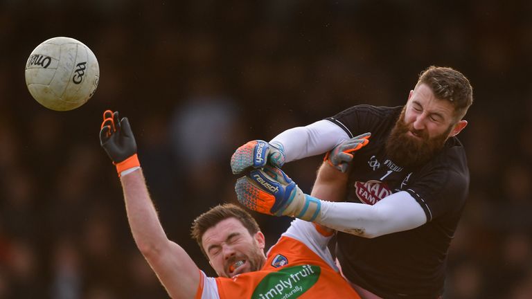 Collision course: Kildare goalkeeper Mark Donnellan and Brendan Donaghy of Armagh compete for possession