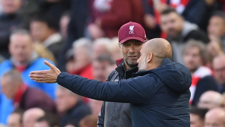 Jurgen Klopp and Pep Guardiola during the Premier League match between Liverpool and Manchester City at Anfield on October 7, 2018 in Liverpool, United Kingdom