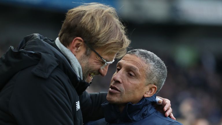 Jurgen Klopp, Manager of Liverpool and Chris Hughton, Manager of Brighton and Hove Albion during the Premier League match between Brighton and Hove Albion and Liverpool at Amex Stadium on December 2, 2017 in Brighton, England.