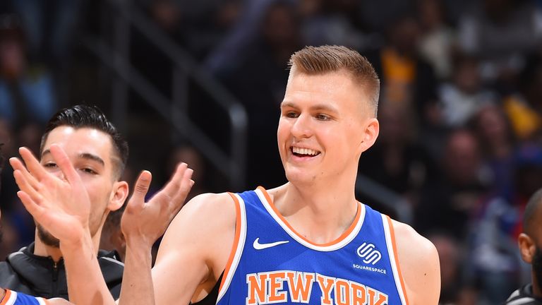 Kristaps Porzingis #6 of the New York Knicks high fives his teammate during the game against the Los Angeles Lakers on January 21, 2018 at STAPLES Center in Los Angeles, California.