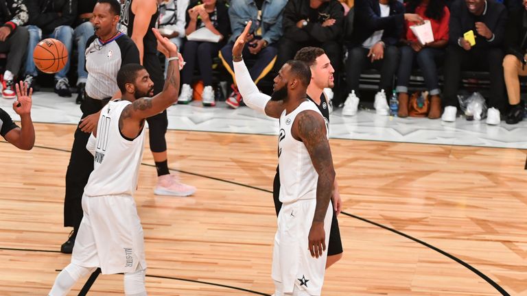 LeBron James #23 and Kyrie Irving #11 of Team LeBron give each other high fives against Team Curry during the NBA All-Star Game as a part of 2018 NBA All-Star Weekend at STAPLES Center on February 18, 2018 in Los Angeles, California.