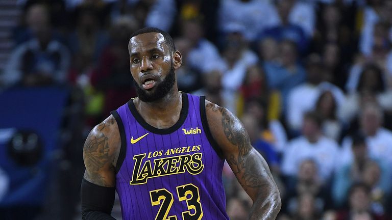 Los Angeles Lakers' LeBron James dribbles the ball up court against the Golden State Warriors