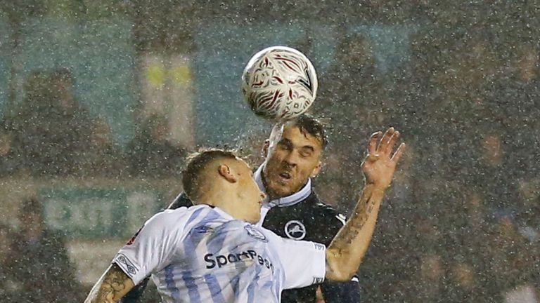 Millwall striker Lee Gregory heads the ball to equalise against Everton