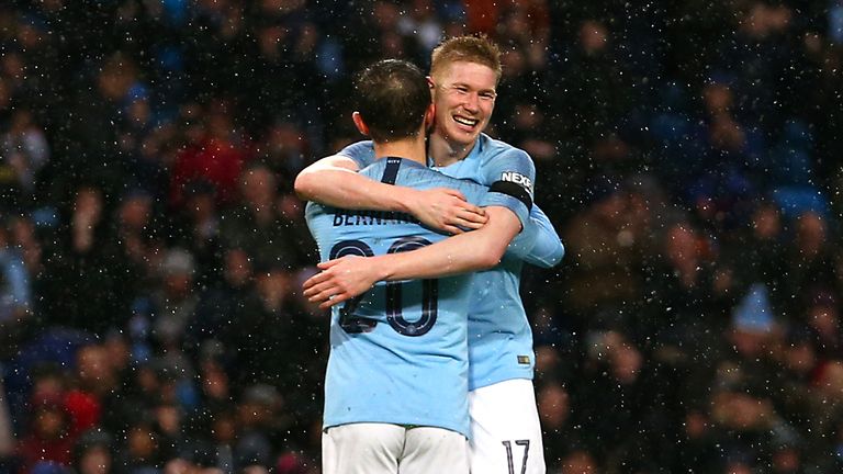 Manchester City's Bernardo Silva (centre left) celebrates scoring his side's second goal of the game with Kevin De Bruyne during the FA Cup fourth round match at Etihad Stadium, Manchester. 