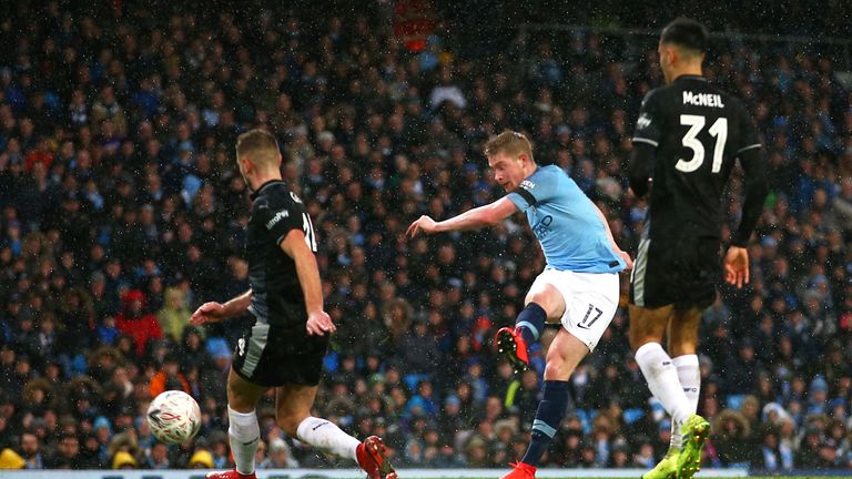 Manchester City's Kevin De Bruyne (centre) scores his side's third goal of the game during the FA Cup fourth round match at Etihad Stadium