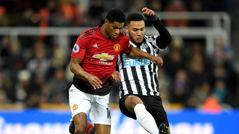 Marcus Rashford is challenged by Jamaal Lascelles