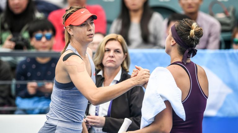 Maria Sharapova (L) of Russia shakes hands with Aryna Sabalenka of Belarus after defeat in their women's singles quarter-final match at the Shenzhen Open tennis tournament in Shenzhen in China's southern Guangdong province on January 4, 2019