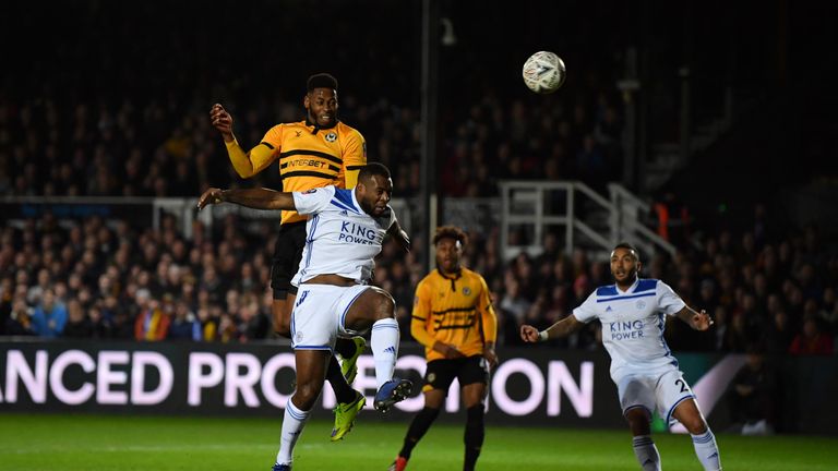 Matt rises above Wes Morgan to head in Newport's opener after 10 minutes