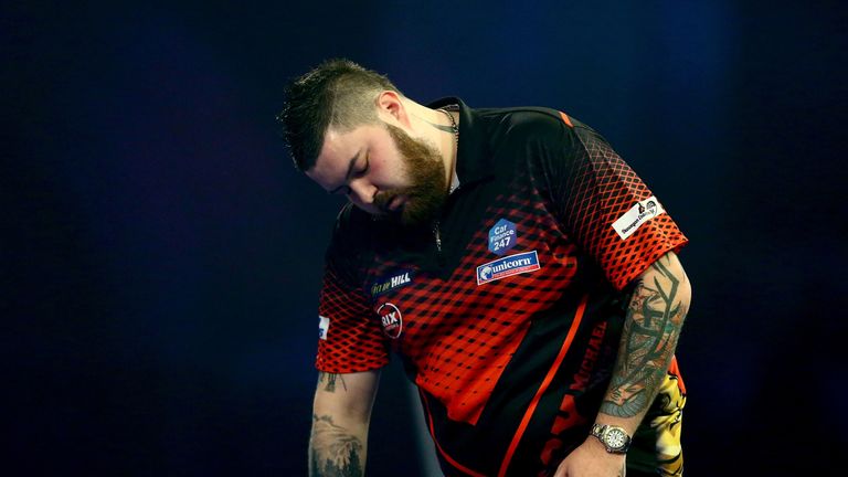 Michael Smith of England looks dejected during the Final match against Michael van Gerwen of the Netherlands during Day 17 of the 2019 William Hill World Darts Championship at Alexandra Palace on January 01, 2019 in London, United Kingdom