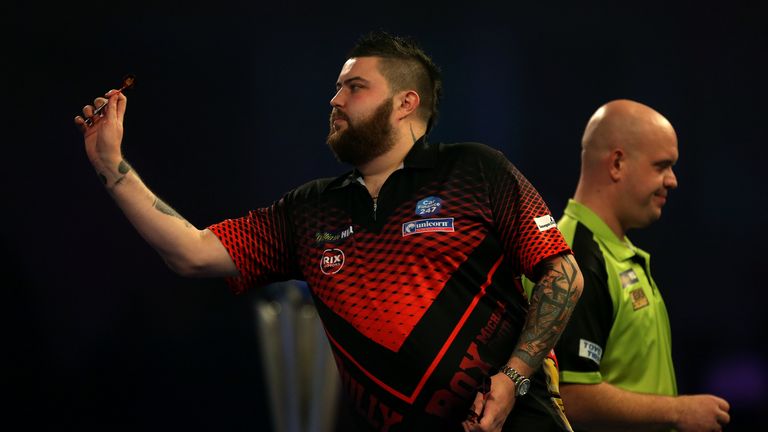 Michael Smith and Michael Van Gerwen during day sixteen of the William Hill World Darts Championships at Alexandra Palace, London