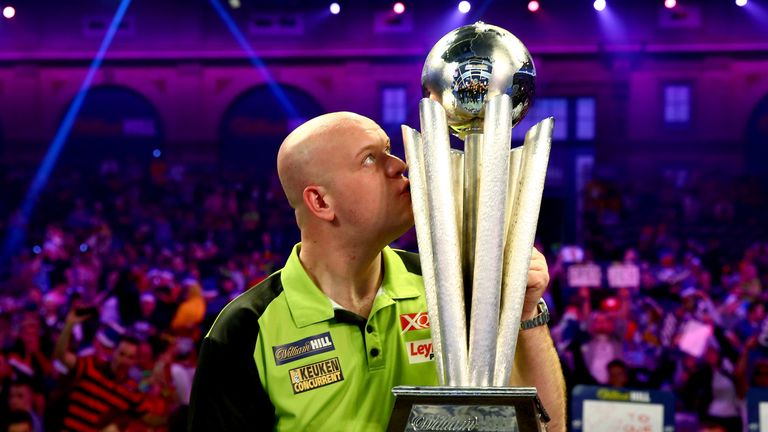 Michael van Gerwen of the Netherlands poses with the trophy after victory in the Final match against Michael Smith of England during Day 17 of the 2019 William Hill World Darts Championship at Alexandra Palace on January 01, 2019 in London, United Kingdom