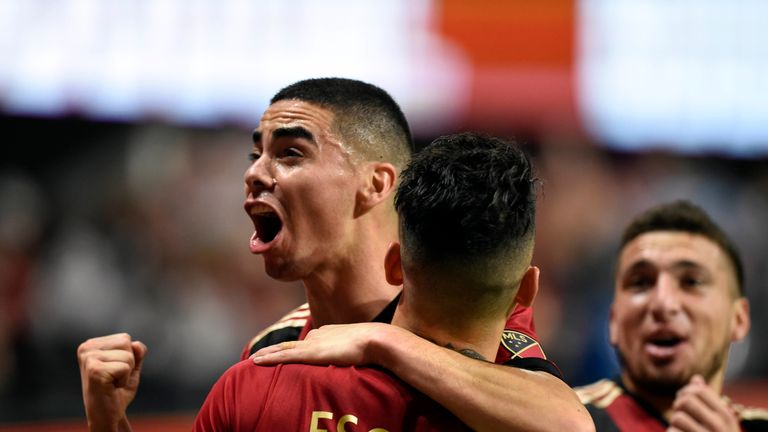 Miguel Almiron celebrates with team-mate during a match against New York Red Bulls (Pic: USA Today/MLSsoccer)