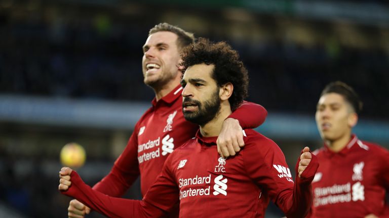 Mohamed Salah celebrates giving Liverpool the lead with Jordan Henderson