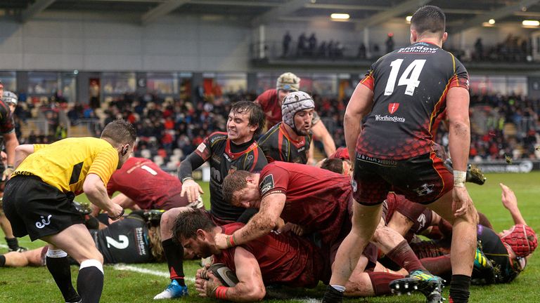 Munster's Jean Kleyn goes over to score his side's first try against the Dragons