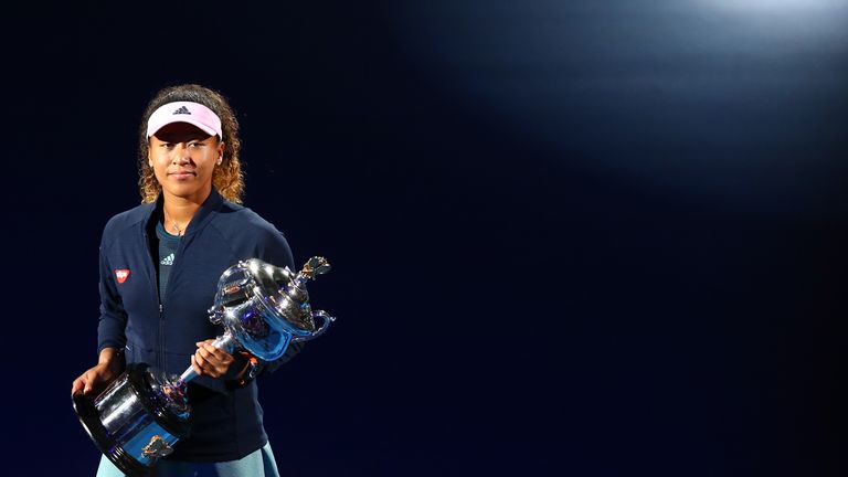 Naomi Osaka of Japan takes part in a lap of honour with the Daphne Akhurst Memorial Cup following victory in her Women's Singles Final match against Petra Kvitova of the Czech Republic during day 13 of the 2019 Australian Open at Melbourne Park on January 26, 2019 in Melbourne, Australia