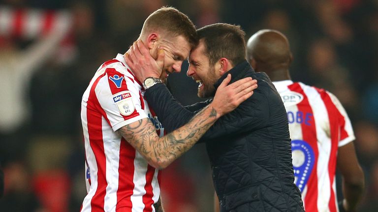 Stoke City manager Nathan Jones celebrates at full time with James McClean