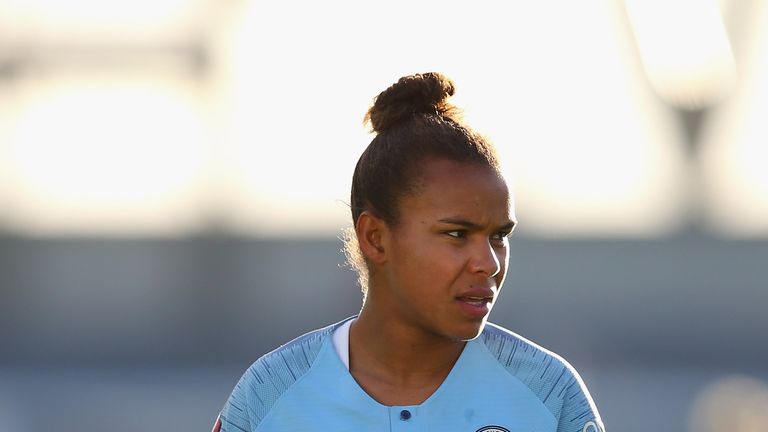 Nikita Parris scored twice as Manchester City preserved their lead at the top of the WSL