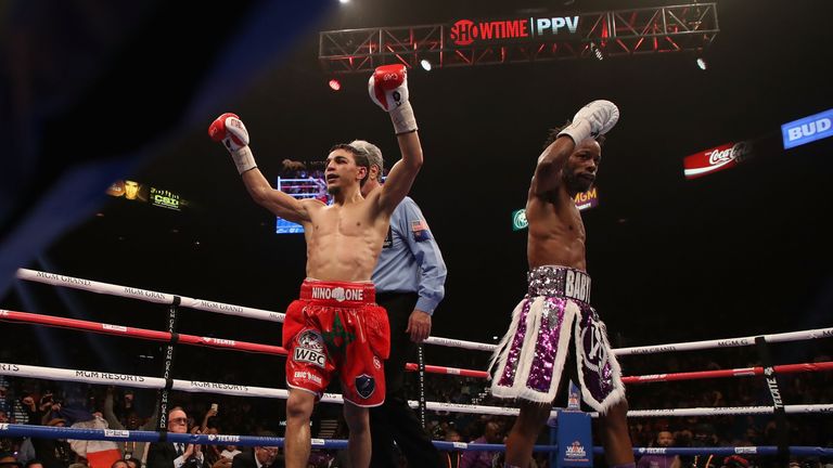 Nordine Oubaali (L) celebrates after winning by unanimous decision over Rau&#39;shee Warren