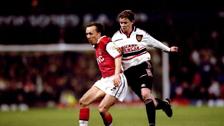 Lee Dixon of Arsenal is closed down by Ole Gunnar Solskjaer of Manchester United in the FA Cup semi-final replay at Villa Park in Birmingham, England. United won 2-1 after extra-time.