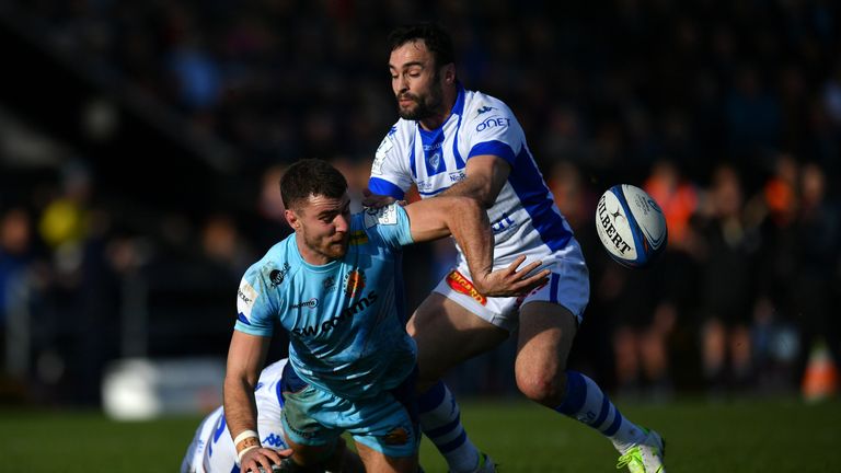 Ollie Devoto of Exeter Chiefs offloads as he is tackled by Robert Ebersohn and Ludovic Radosavljevic of Castres Olympique during the Champions Cup match between Exeter Chiefs and Castres Olympique at Sandy Park on January 13, 2019 in Exeter, United Kingdom