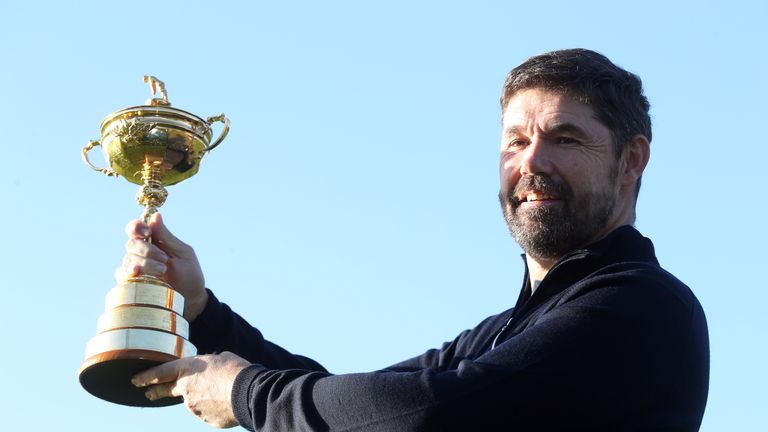 European Ryder Cup captain Padraig Harrington poses with the trophy during the Team Europe Ryder Cup press conference at the Wentworth Golf Club