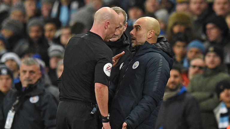 Pep Guardiola is spoken to by referee Anthony Taylor