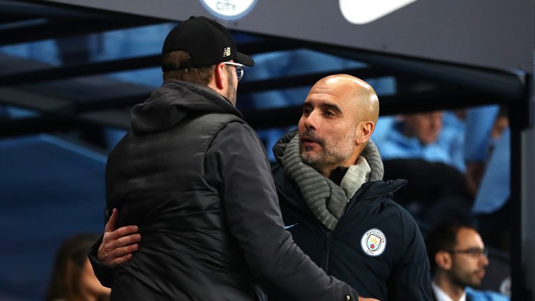 Pep Guardiola and Jurgen Klopp embrace before kick-off