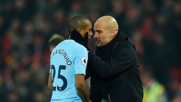 Fernandinho (L) with Pep Guardiola