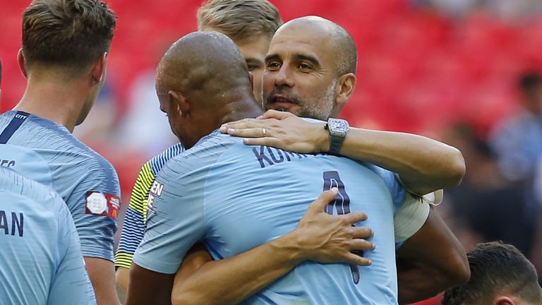 Pep Guardiola with Man City captain Vincent Kompany