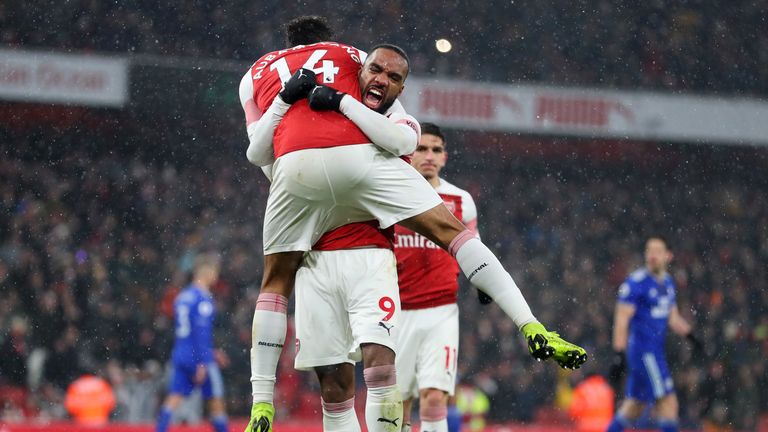 Pierre-Emerick Aubameyang celebrates scoring his penalty with Alexandre Lacazette