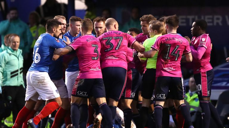 The players clash in a heated cup tie following QPR's equaliser
