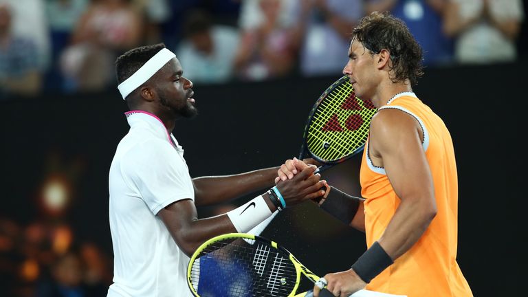 Rafael Nadal of Spain and Frances Tiafoe of the United States embrace at the net following their quarter final match during day nine of the 2019 Australian Open at Melbourne Park on January 22, 2019 in Melbourne, Australia