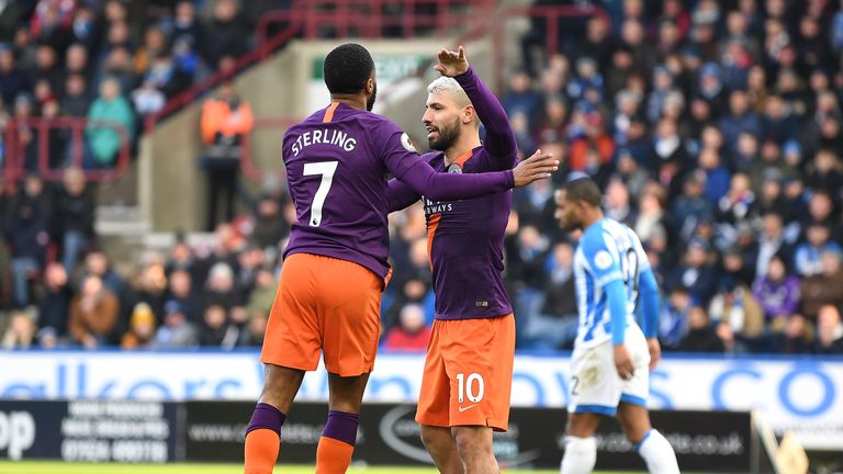 Raheem Sterling celebrates with Sergio Aguero after scoring his side's second goal during the Premier League match between Huddersfield Town and Manchester City at John Smith's Stadium on January 20, 2019 in Huddersfield, United Kingdom.
