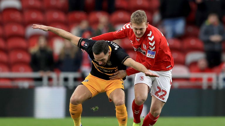 Robbie Willmott of Newport County is challenged by George Saville of Middlesbrough during the FA Cup Fourth Round match between Middlesbrough and Newport County AFC at Riverside Stadium on January 26, 2019 in Middlesbrough, United Kingdom.