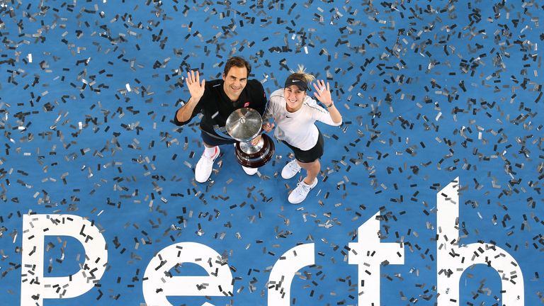 Roger Federer and Belinda Bencic of Switzerland pose with the Hopman Cup after winning the final against Alexander Zverev and Angelique Kerber of Germany on day eight of the 2019 Hopman Cup at RAC Arena on January 05, 2019 in Perth, Australia.