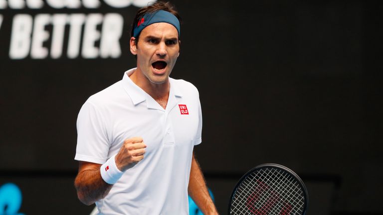 Switzerland's Roger Federer reacts after a point against Britain's Daniel Evans during their men's singles match on day three of the Australian Open tennis tournament in Melbourne on January 16, 2019