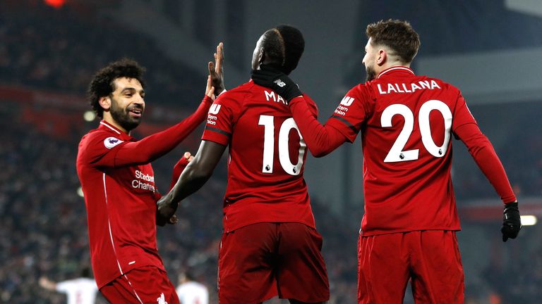 Liverpool's Sadio Mane (centre) celebrates scoring his side's fourth goal of the game