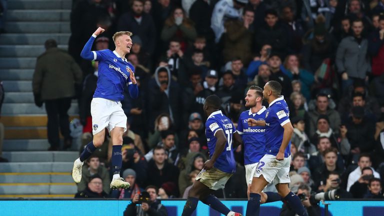 Sam Surridge of Oldham Athletic celebrates with team mates after scoring their team's first goal from the penalty spot during the FA Cup Third Round match between Fulham and Oldham Athletic at Craven Cottage on January 6, 2019 in London, United Kingdom
