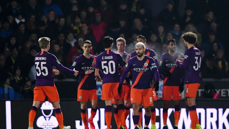 Sergio Aguero of Manchester City celebrates with team-mates after scoring their side's first goal during the Carabao Cup Semi Final Second Leg match between Burton Albion and Manchester City at Pirelli Stadium on January 23, 2019 in Burton-upon-Trent, United Kingdom