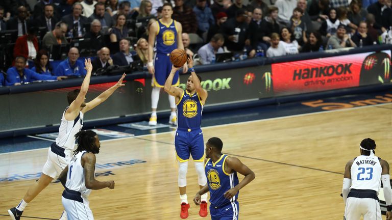 Stephen Curry of the Golden State Warriors takes a shot against the Dallas Mavericks