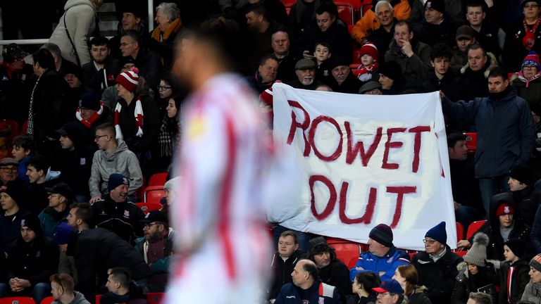 Fans hold a Gary Rowett out sign during  Stoke City's home defeat to Bristol City