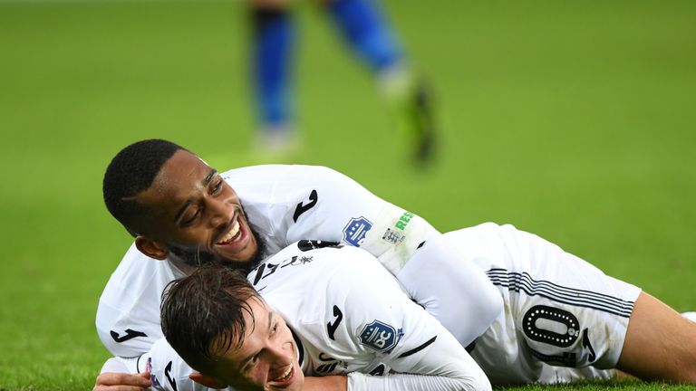 Bersant Celina is mobbed by Leroy Fer after his fine goal